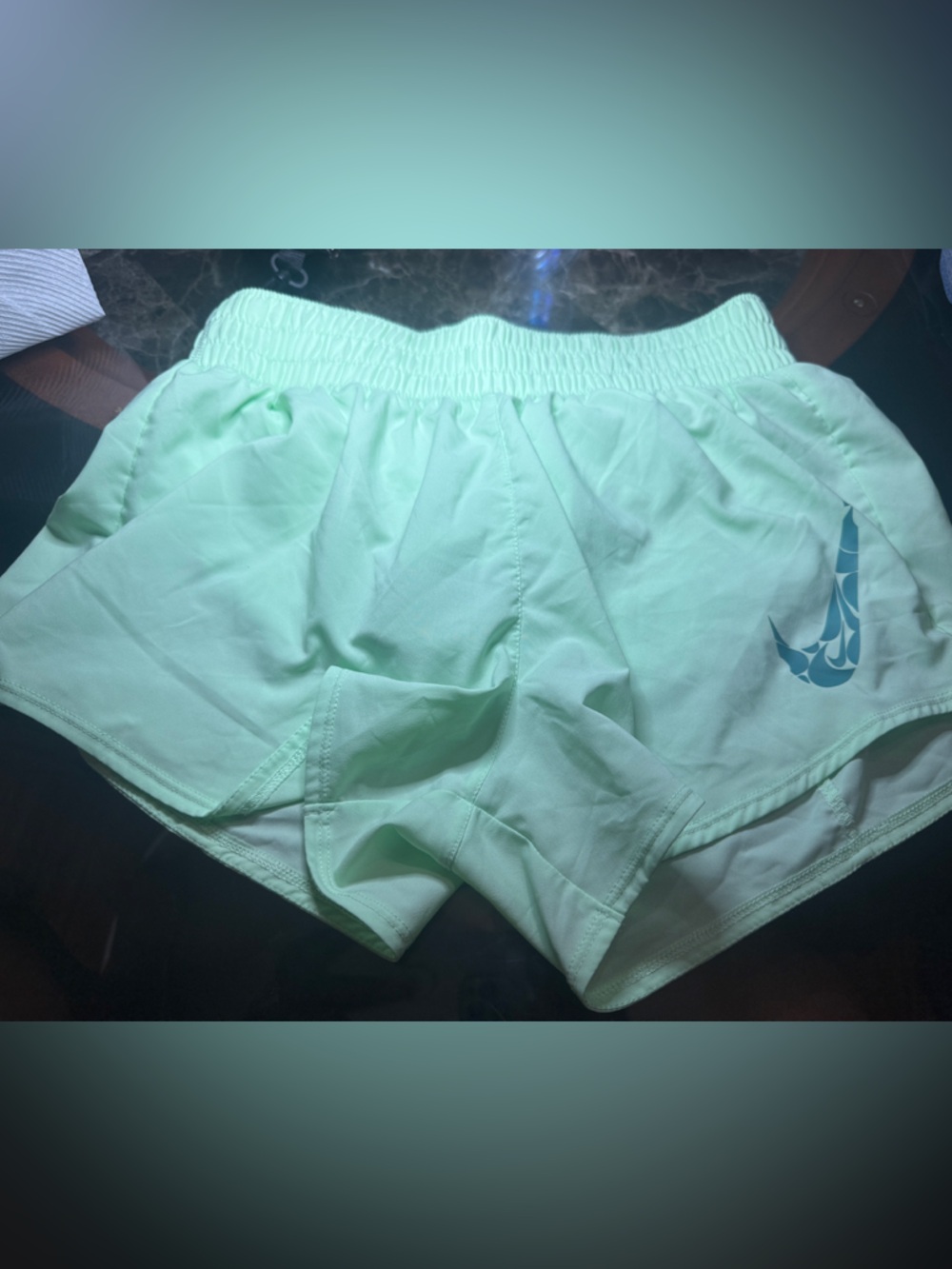 Nike Mint Green Running Shorts with Blue Swoosh